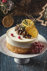 Double Christmas cheesecake with berries on a dark background