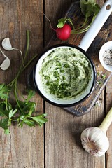  Flavored with herbs and garlic butter and fresh radishes overhead rustic wooden table