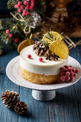 Double Christmas cheesecake with berries on a dark background