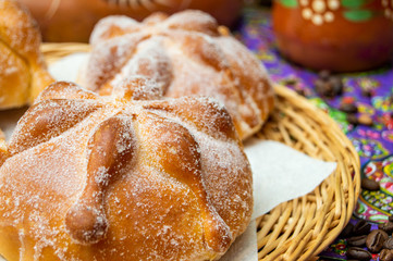 Traditional Mexican bread of the dead (pan de muerto) with coffe