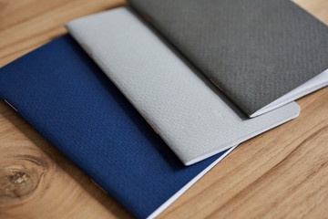 Small notebooks on a wooden desktop