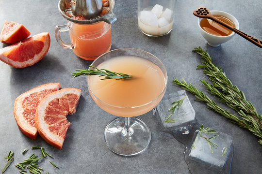 Blood orange margarita with rosemary and melting ice