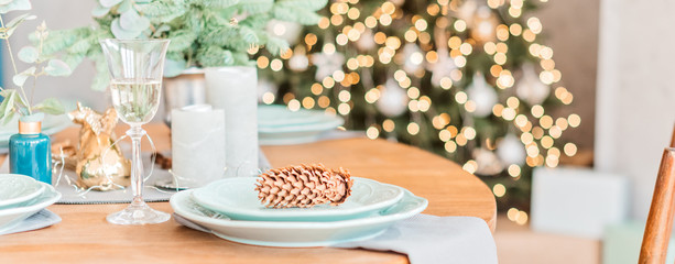 Christmas wooden table, a pine on white plate, table setting