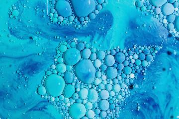 Vibrant blue bubbles of ink