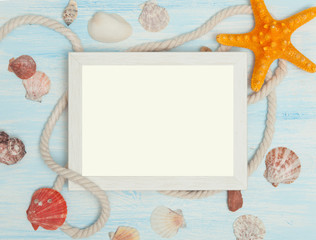 Fototapeta na wymiar Sea background with frame and blue painted wood, rope, starfish, shells