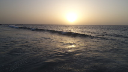 Obraz premium landscape and sunset on the Atlantic coast watching the breaking of the waves