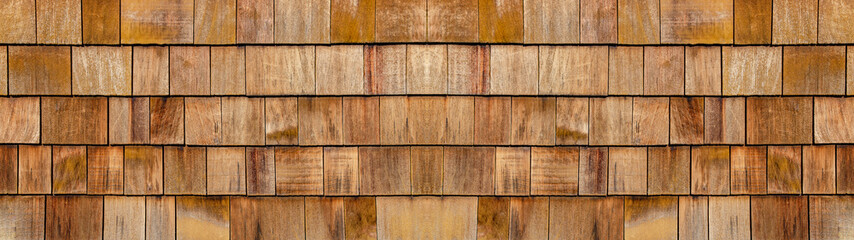 Old brown rustic light bright wooden shingle wall  texture - wood background panorama banner long...