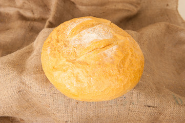 white bread on burlap background