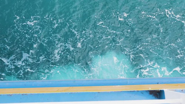 Close up footage of waves at side of the ferry. Ferry crusing in deep waters.