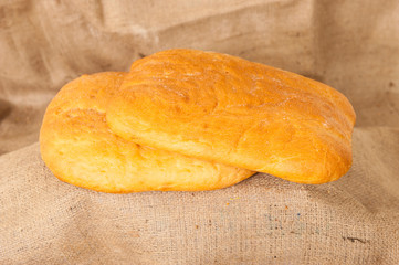 white bread on burlap background