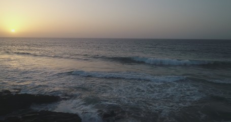 Obraz premium landscape and sunset on the Atlantic coast watching the breaking of the waves