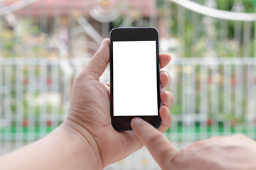 A close-up shot of a man holding a smartphone