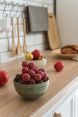 Berry and fruit on the kitchen table, healthy breakfast