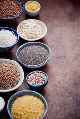 Various organic cereals and grains in different bowls