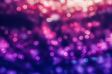 Abstract holiday background with multicolored defocused lights