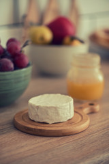Cheese, honey and fruit on the kitchen table,healthy breakfast