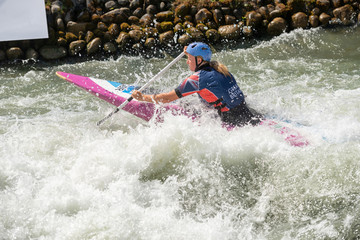 Great Britain canoe slalom athlete paddles through white water