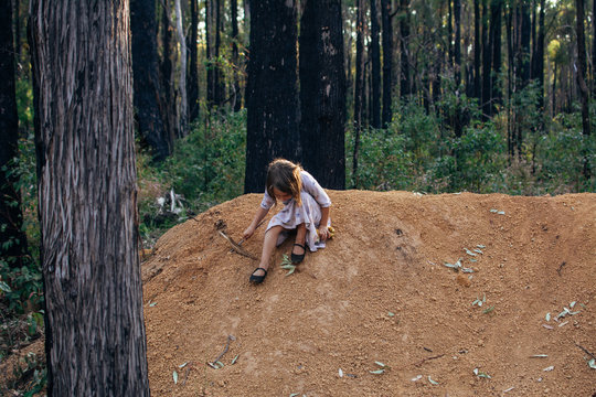 Child playing on gravel patch