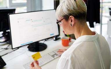 Woman buying online in office