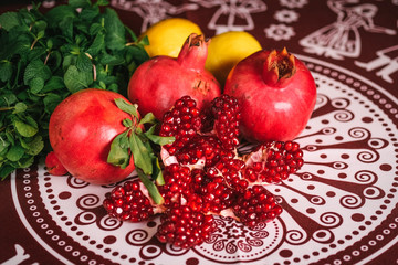 Assorted fresh fruits on a colorful oriental background top view
