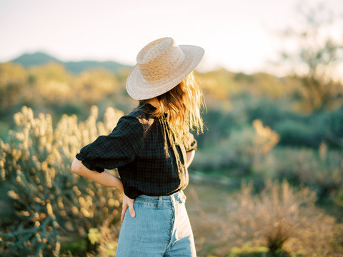 Portrait of young stylish woman in desert