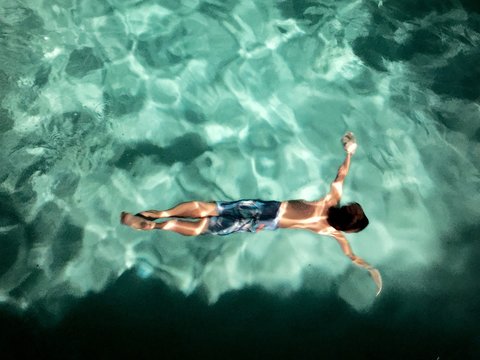 Boy Swimming at Night