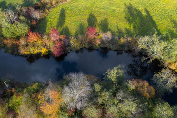 Latvian autumn nature. VIew from the top. Forest and river Jugla.