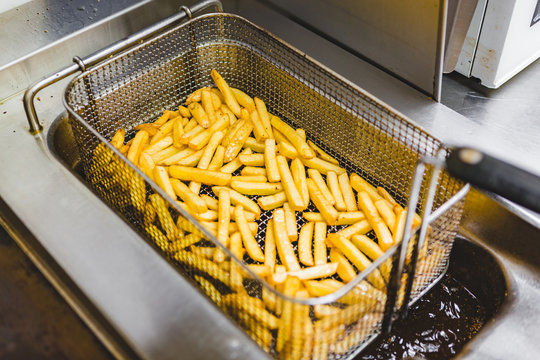 Cooking French Fries at the Deep Fryer
