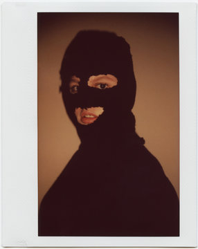Young Woman In Black Balaclava