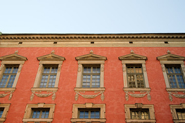 Obraz premium Red vintage building with windows. Copy space