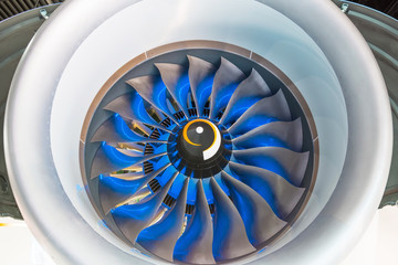 Turbo jet engine of the plane, close up in the blue light from the inside.