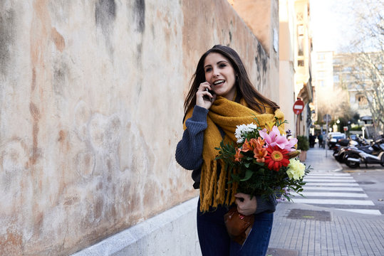 Female with floral bouquet street.
