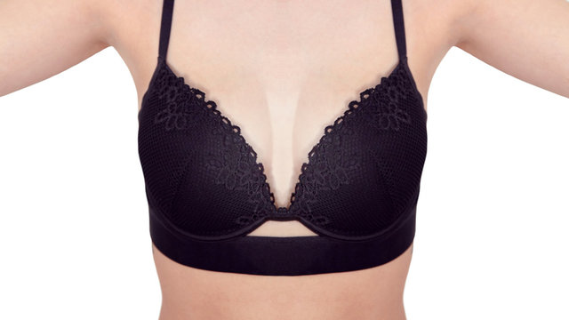 Front view close-up of slim woman wearing black sports bra with floral pattern
