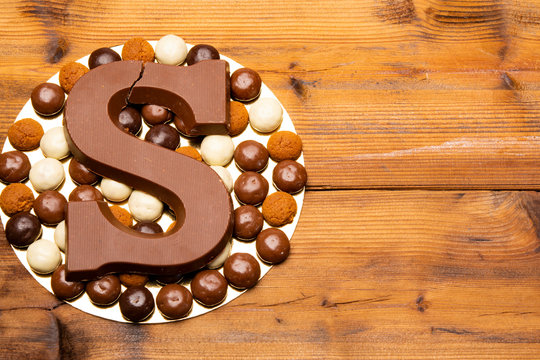 Celebration of Saint Nicholas, patron saint of children in Netherlands, Belgium, Luxembourg and North of France in first week of December, chocolate letters S and ginger cookies