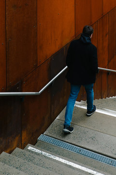 Young guy descending on steps