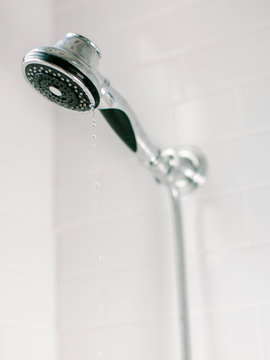 Shower head with water slowly dripping
