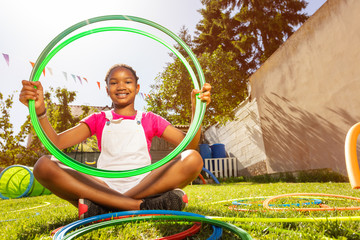 Nice portrait of a girl on playground with hoops © Sergey Novikov