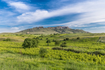 Agricultural field in front of ancient mountains