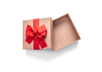 Golden gift box with ribbon isolated on a white.