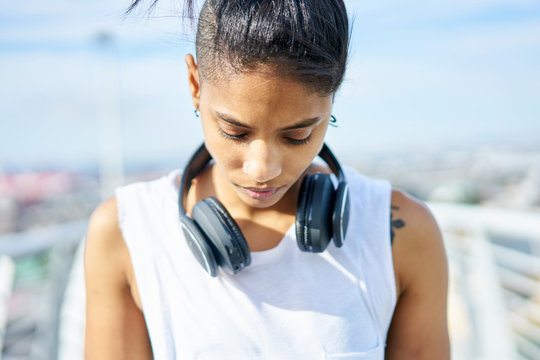 Portrait of a young attractive and fit woman during an urban workout