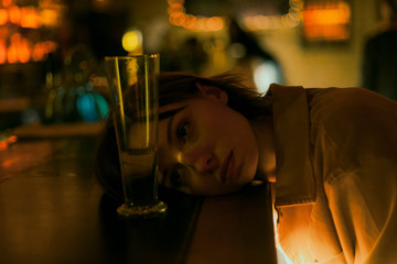 portrait of a girl with a glass of wine at bar