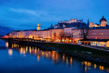 Panorama of Salzburg Hohensalzburg castle and Salzach River Austria night