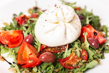 Salad with buratta cheese and tomatoes