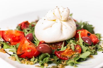 Salad with buratta cheese and tomatoes
