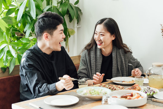 Young couple having lunch in the restaurant