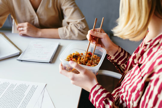 Businesswomen working together in workspace.