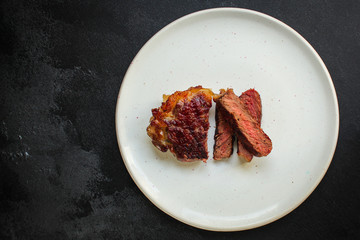 beef steak fried grill (delicious meat, sliced ​​portion serving, roast rare) menu concept. food background. copy space. Top view