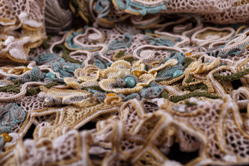 Crochet knitting. Lace of flowers.  Handmade Irish lace as a background.Handmade colorful macrame pattern background,macrame texture,ECO friendly,Modern summer concept,knitting