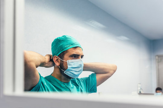 Doctor Covering His Face With Mask