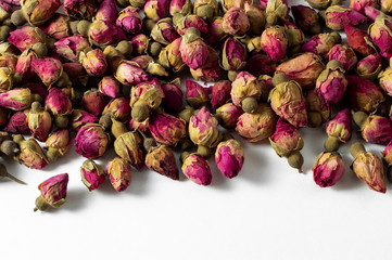 red and pink rose buds tea on white banner